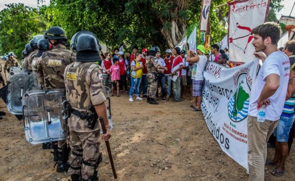 Protesters confronted by armed police