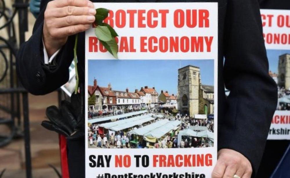 Sign reading 'protect our rural economy'