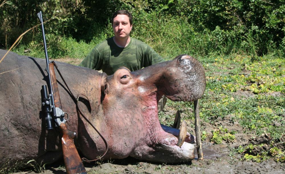 Trophy hunter with hippo
