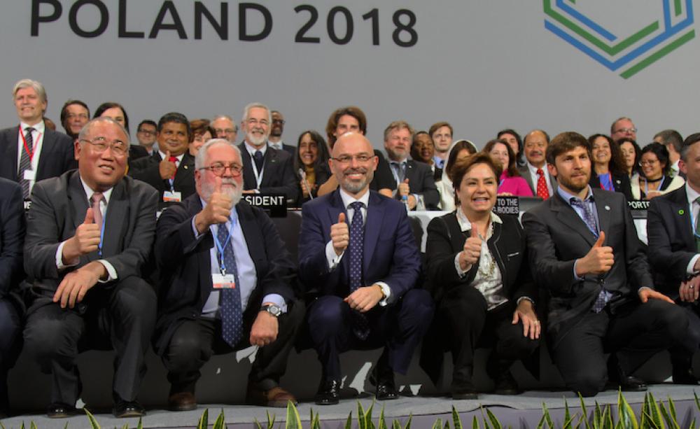 Diplomats and minsters pose for photographers at the close of Cop24
