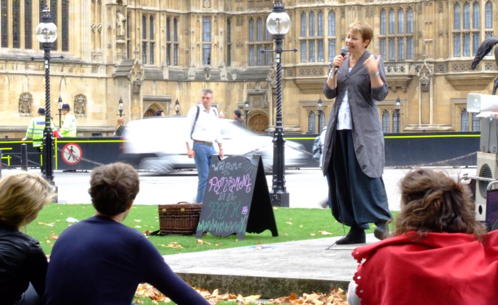 Caroline Lucas speaking outside of Parliament