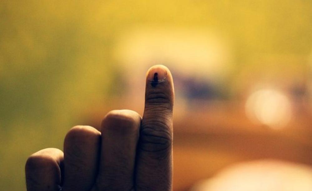 The ink-marked finger of an Indian voter