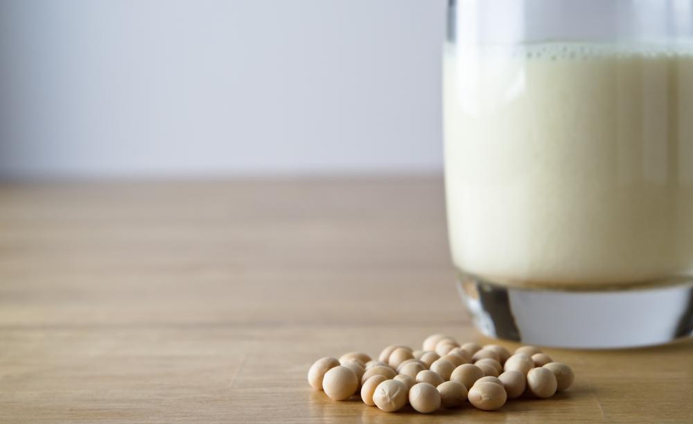 Glass of soya milk with soya beans