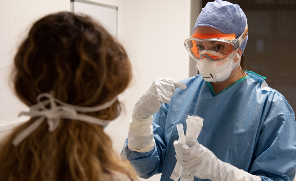 Health worker treating patient