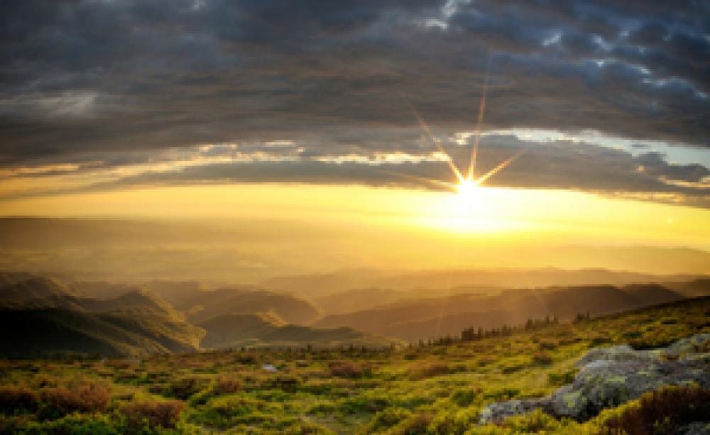 Sunset over rolling hills