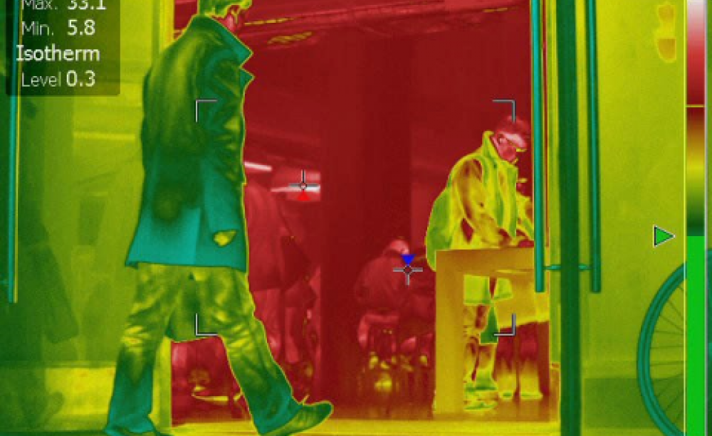 Infra-red image showing how open shop doors pour heat into our streets. Image: closethedoor.org.uk