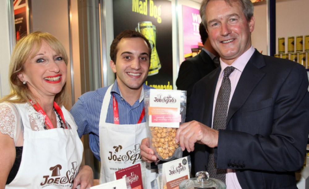 Would you buy popcorn from Owen Paterson? And no, it's not GM. With Joe &amp; Sephs Gourmet Popcorn. Photo: UKTI via Flickr.com.