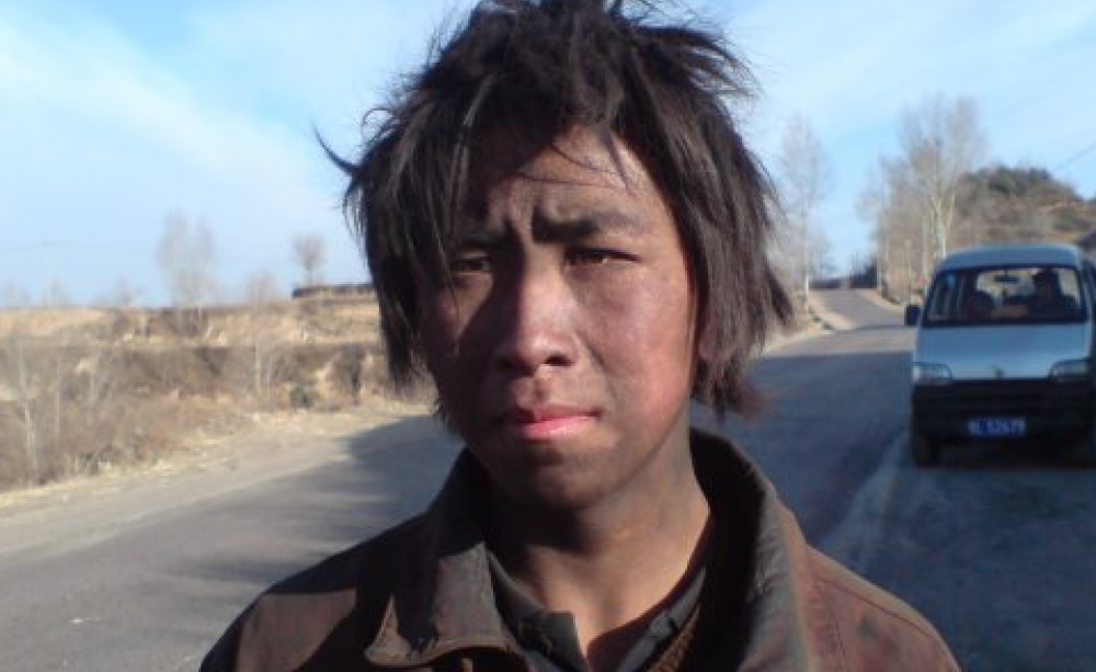 A happy future for coal? Young coal worker in Linfen, Shanxi, China. Photo: andi808 via Flickr.com.