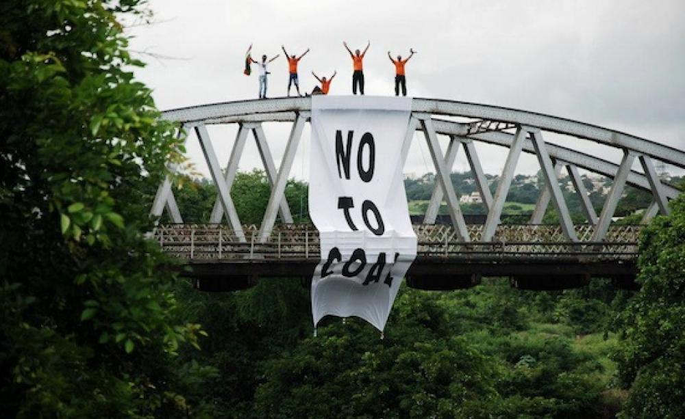 'No to coal' banner over bridge on the way to the power plant site. Photo: Naresh Roodur.