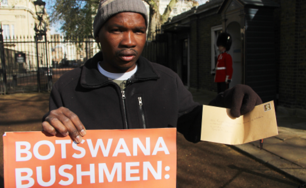 Jumanda Gakelebone outside Clarence House in London today to deliver his letter to Prince Charles. Photo: Survival International.