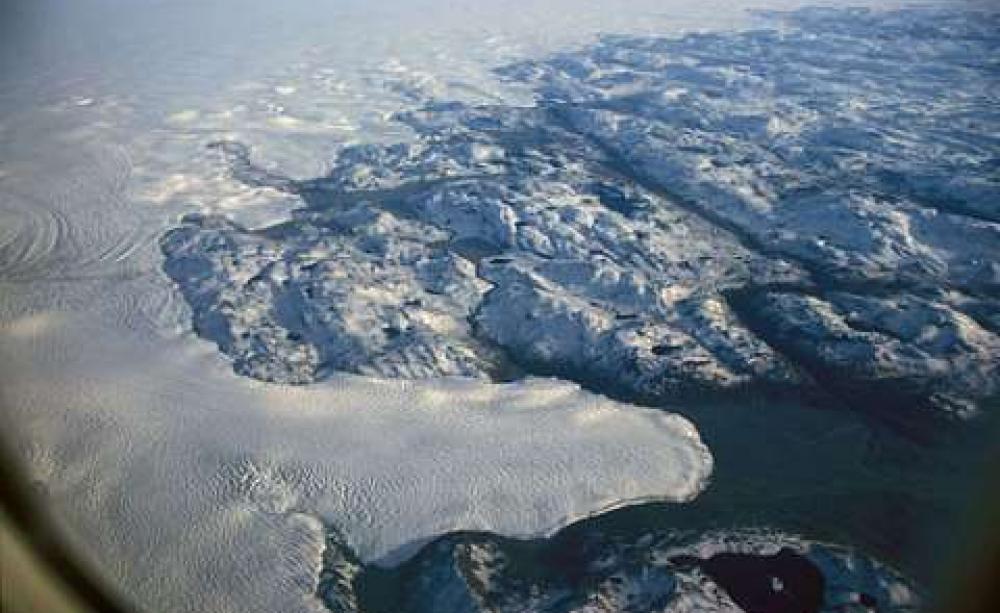 Melting away: an aerial view of the margin of Greenland's threatened ice sheet. Photo: Hannes Grobe / Alfred Wegener Institute via Wikimedia Commons.