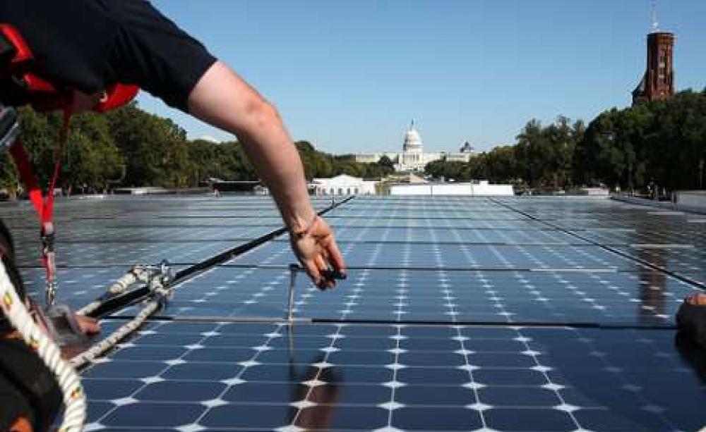 Bypassing Washington DC, the fossil fuel lobby works discreetly at state level. Photo: Solar Decathlon on the National Mall in Washington, 2009. By Stefano Paltera / US Dept. of Energy Solar Decathlon via Flickr.