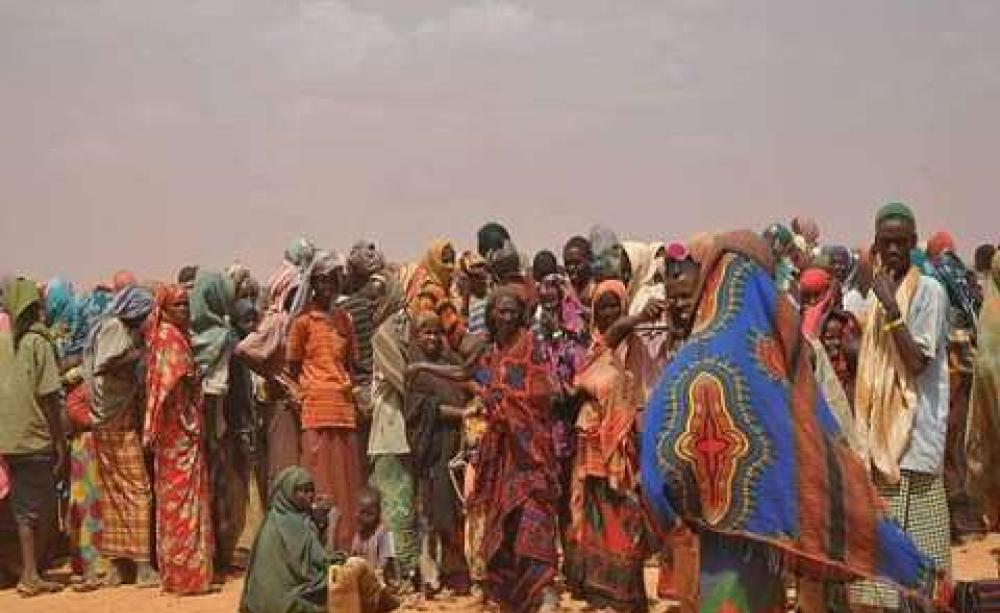 Somalis displaced by drought in 2011 queue at a refugee camp in Ethiopia. Image: Cate Turton/DFID via Wikimedia Commons.