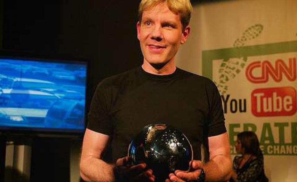 With all that money, he's got plenty to smile about. Bjorn Lomborg at the CNN / You Tube Debate on Climate Change. Photo: Mat McDermott via Flickr.