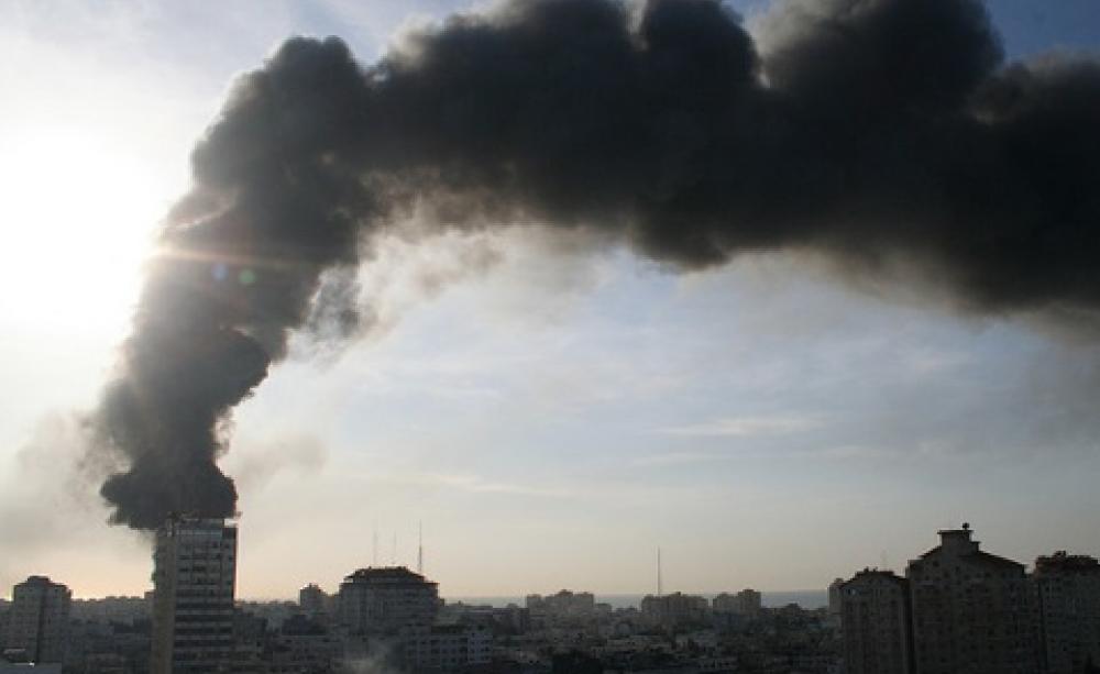 Black smoke billows from the UNWRA compound set ablaze by Israel in Operation Cast Lead, 15th January 2009. The compound was burned to the ground. Photo: Al Jazeera English via Flickr.