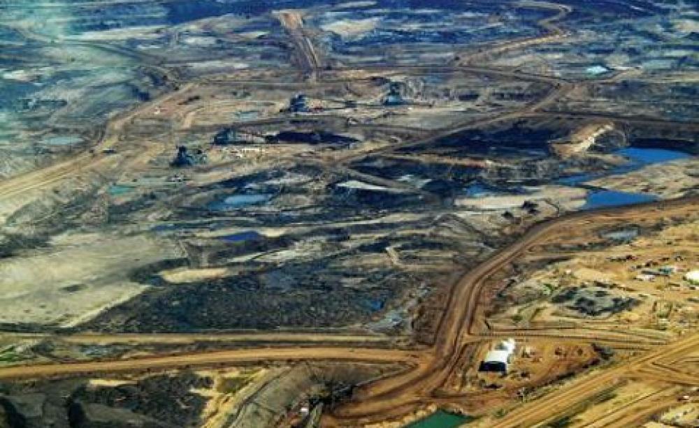 Heavy oil undergoing extraction from tar sands, Alberta. Canada. Photo: Howl Arts Collective via Flickr.