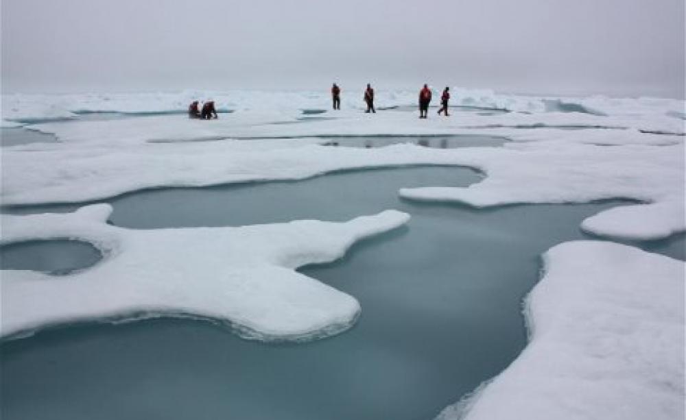 Melting point: researchers study Arctic sea ice and melt ponds on the Chuckchi Sea. Photo: Kathryn Hansen / NASA via Wikimedia Commons.