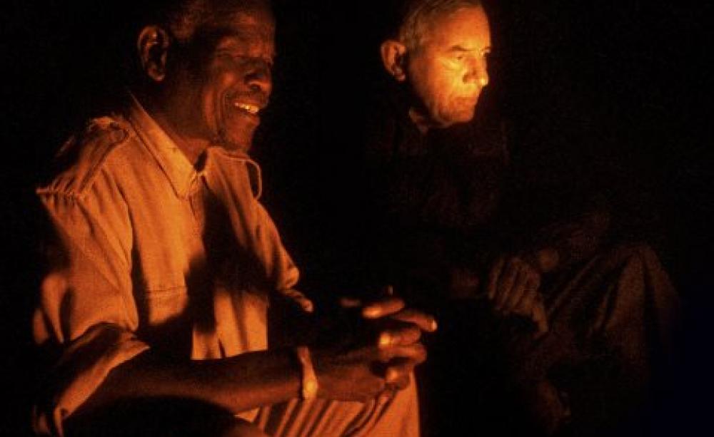 Ian and Magqubu minding the nightly fire to protect against predators. Photo: www.trevorbarrettphoto.co.uk/ .
