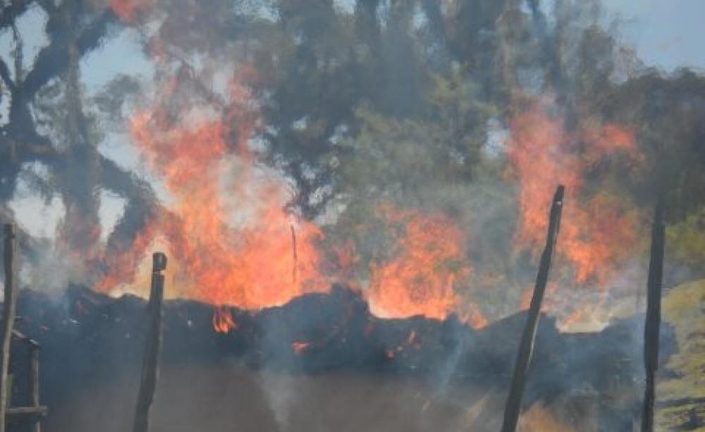 Torched Senger homes. Photo: Dean Puckett.