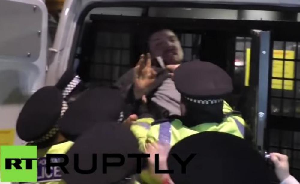 An Occupy Democracy protester is arrested by police in Parliament Square on 14th February 2015. Photo: still from RT report.