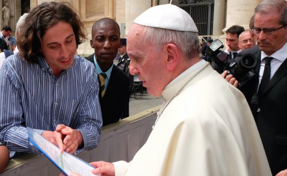 Pope Francis reads the Catholic Climate Petition with GCCM representatives Tomás Insua from Argentina and Allen Ottaro from Kenya. Photo: Fotografia Felici.