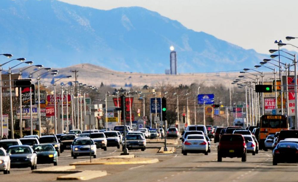Behind Juan Tabo Boulevard, Albuquerque, the promise of a solar future: Sandia's solar tower, its mirrors reflecting the New Mexico sunlight. Photo: Randy Montoya / Sandia Labs via Flickr (CC BY-NC-ND).