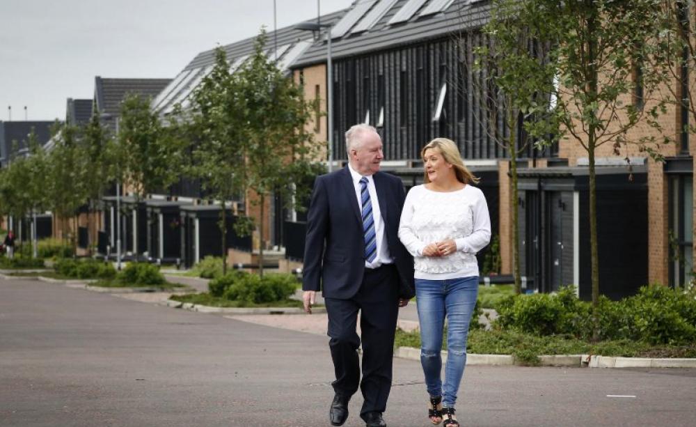 Scotland's Social Justice Secretary Alex Neil with Kimberley Stoddart, a tenant of West of Scotland Housing Association. Photo: Scottish Government via Flickr (CC BY-NC).