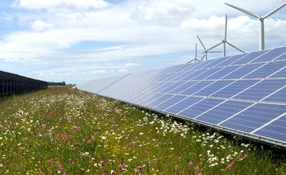 Cooperative and renewable: the Westmill wind and solar farm in south Oxfordshire. Photo: Richard Peat via Flickr (CC BY-NC-ND).