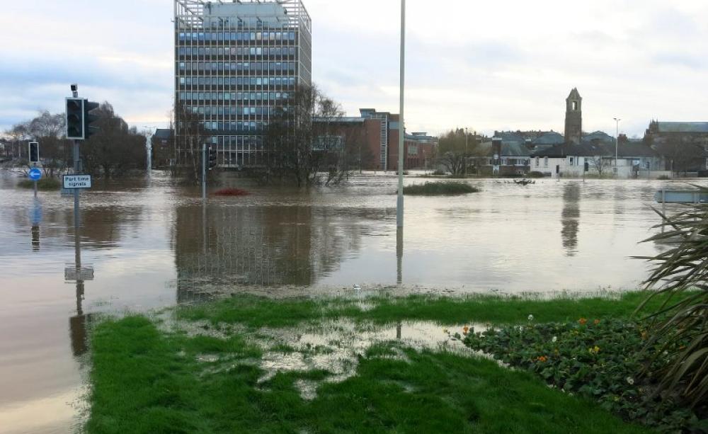 Flooding in Carlisle. With warming climate, there's much worse to come. Photo: John Campbell via Flickr (Public Domain).