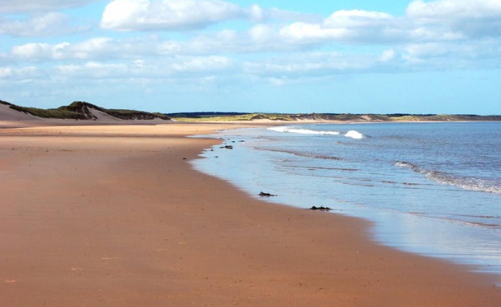 Sand dunes and beach at Druridge Bay, Northumberland, where a huge new opencast coal mine is planned. Photo: Fiona in Eden via Flickr (CC BY-NC).