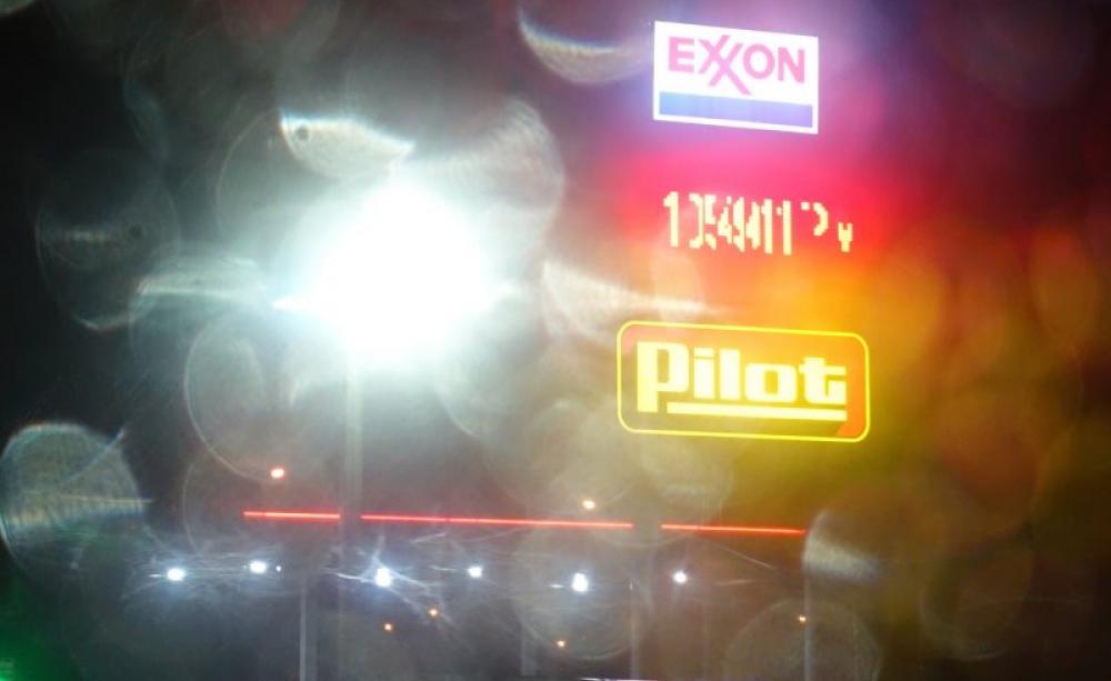 Smoke, mirrors and raindrops: Exxon station at Columbus, Montana. Photo: J.C. Burns via Flickr (CC BY-NC-ND).
