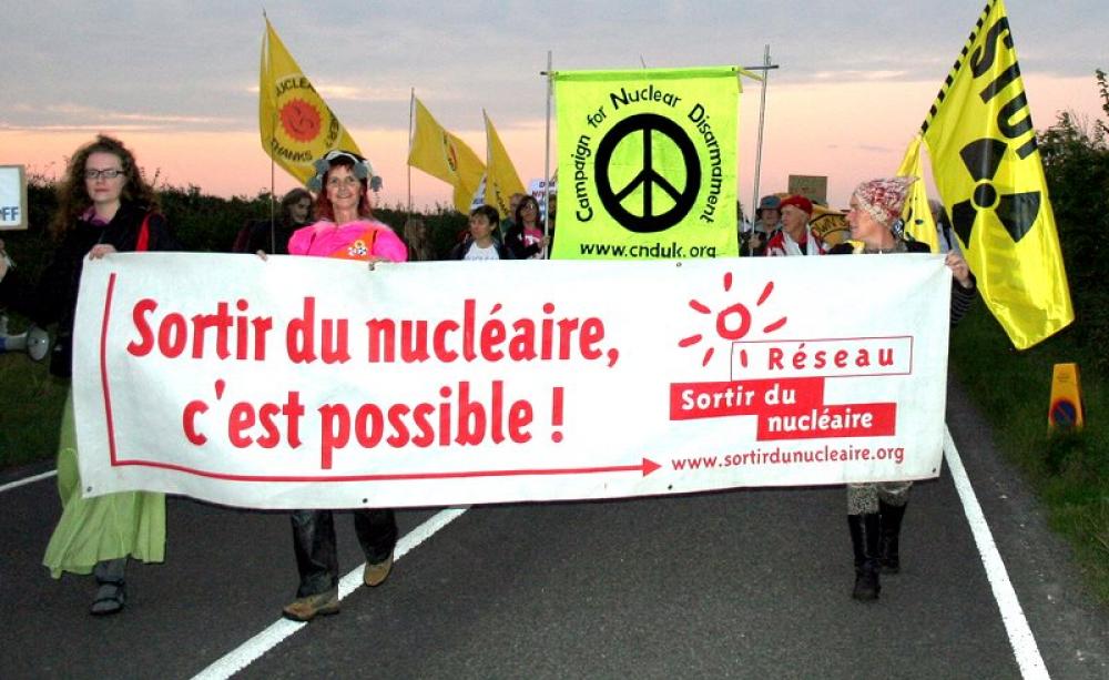 'Getting out of nuclear - we can do it!', reads the banner at this 2011 protest against Hinkley C. French Energy Minister Segolene Royal might just share the opinion. Photo: Campaign for Nuclear Disarmament via Flickr (CC BY).