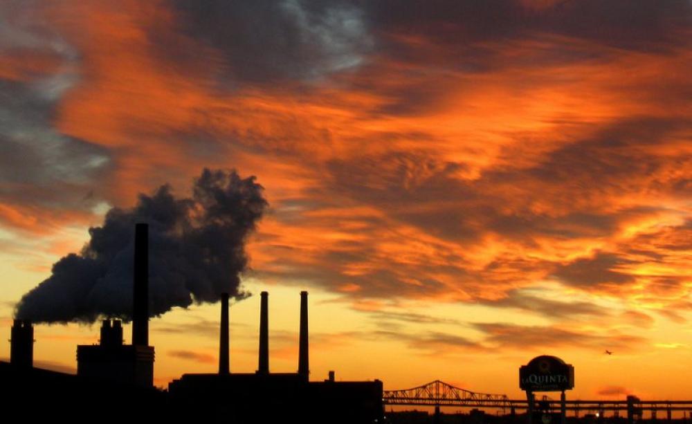 Sunrise over the Mystic River in Medford-Somerville-Boston, Massachusetts - the area that ExxonMobil is accused of endangering by its climate change deceit. Photo:  Paul via Flickr (CC BY-NC-SA).