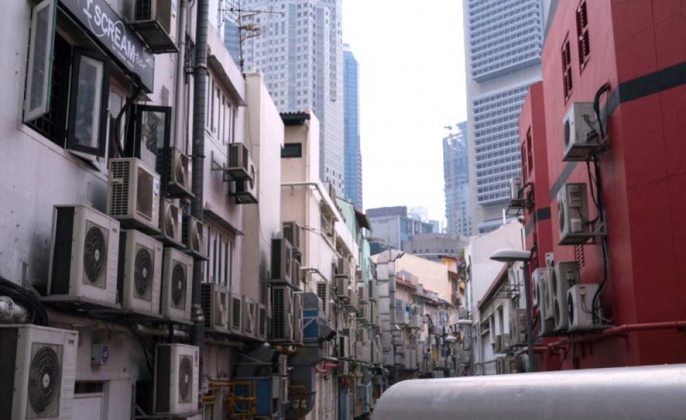 The HFC gases that run most of the world's heat pumps and air conditioners, like these ones in Singapore, are very powerful greenhouse gases. But now the world has agreed to solve the problem. Photo: Rym DeCoster via Flickr (CC BY).