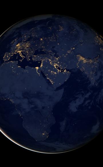 As the sun sets around the world, the lights are turned on, but in some places, there are more lights that others. (c) NASA