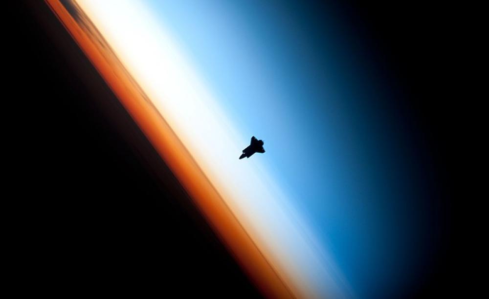 The space shuttle Endeavour appears to straddle the stratosphere and mesosphere (c) Nasa