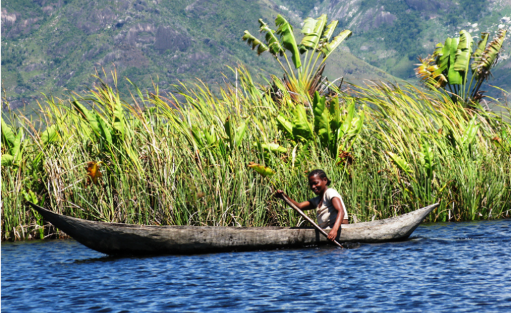 Antanosy woman on the estuary system next to the QMM mine at Mandena