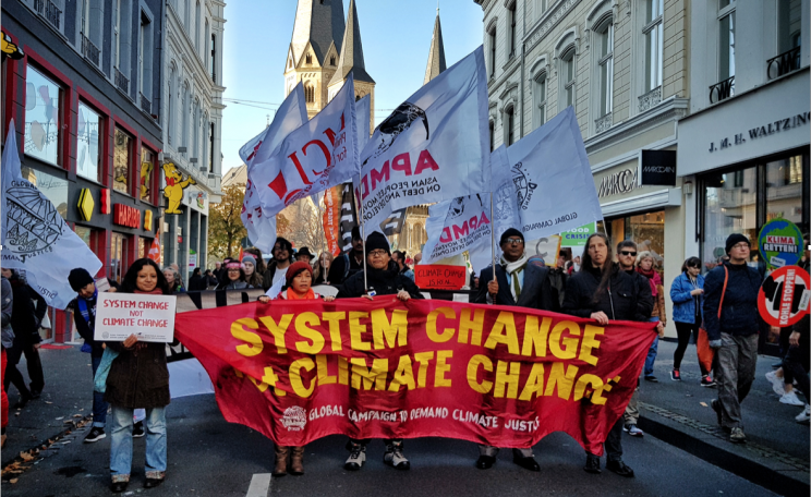 Climate justice activists from Nepal, Peru, Germany, the USA and the Philippines marching in Bonn during COP23