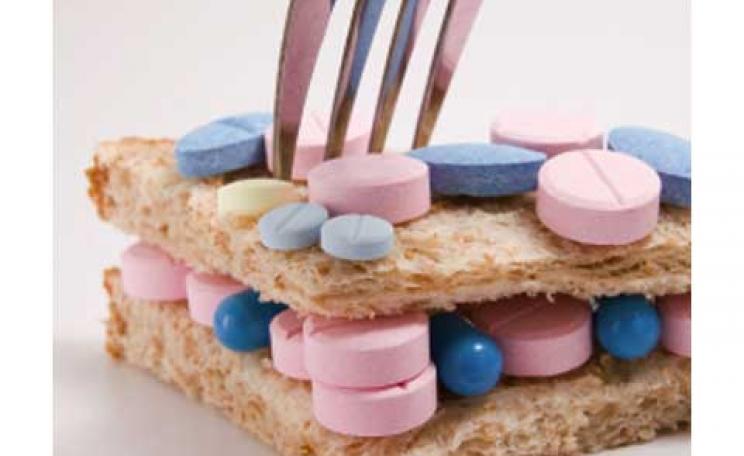 Pill sandwich with a fork sticking out