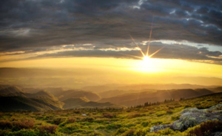 Sunset over rolling hills