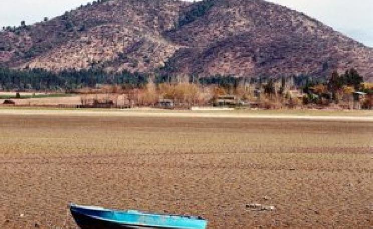 Boat on dried out lakebed