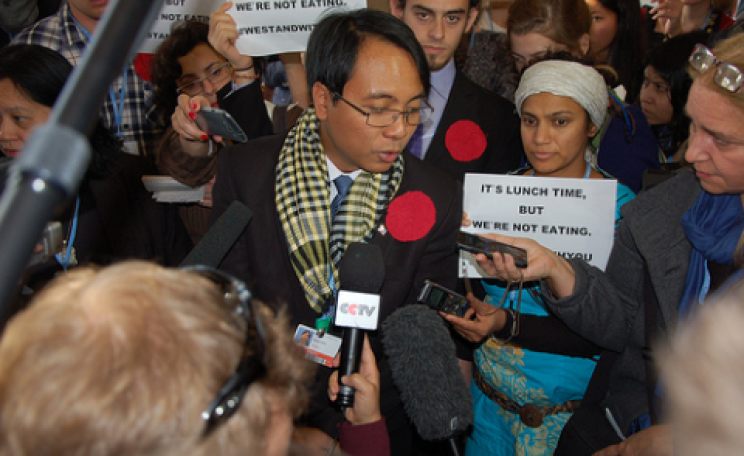 Yeb Sano surrounded by supporters at COP19.