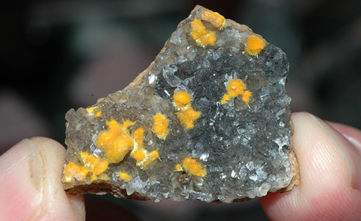 Calcite with boltwoodite encrustations from the Rossing uranium mine in Namibia. Photo:  Striving to a goal via Flickr.com.