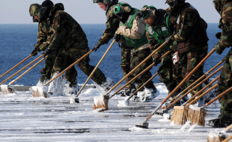 Sailors decontaminate the flight deck aboard USS Ronald Reagan, March 23 2011. Official U.S. Navy Page / Kevin B. Gray via Flickr.com.