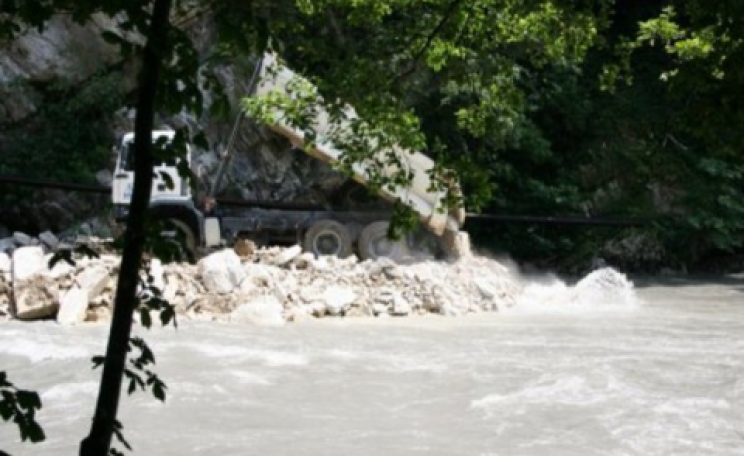 Construction waste from the Sochi Winter Olympics construction is dumped in the Mzympta River. Photo: SochiWatch.