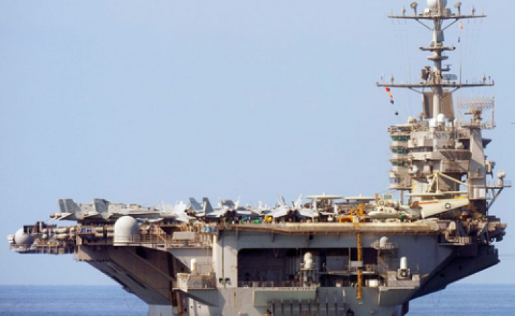 The US military is the world's single largest consumer of fossil fuels. Pictured here is US Navy Aircraft Carrier USS John C Stennis. Photo: Defence Images via Flickr.com.