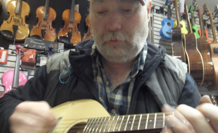 Brian Nicholson runs the islands' mandolin, ukulele and guitar shop. Photo: Thembi Mutch.