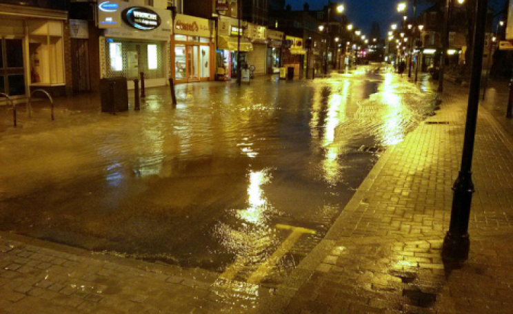 Going to waste ... a burst water main in Wealdstone, Harrow, 7th Feb 2014. Photo: timku via Flickr.com.