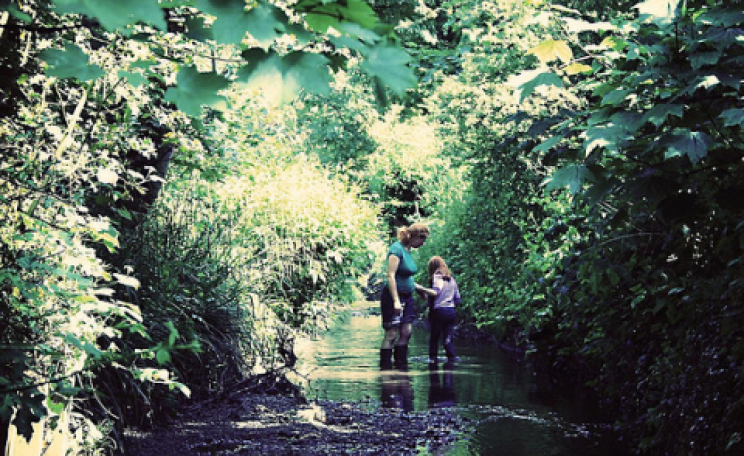 Kate and Flo knee deep in The Quaggy. Photo: Jon Nicholls (fotologic) via Flickr.com.