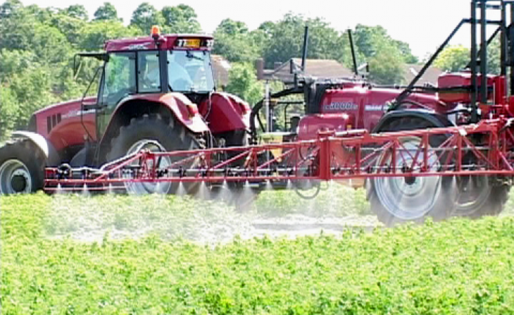 A regular sight in rural areas - pesticides being applied to crops. Photo: Billy Ridgers.